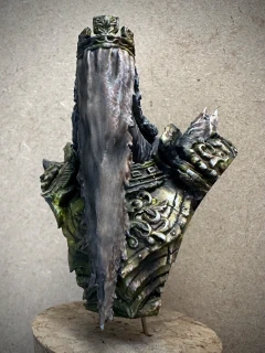 The same bust from before, but with yellows and browns starting to replace the monochrome.
