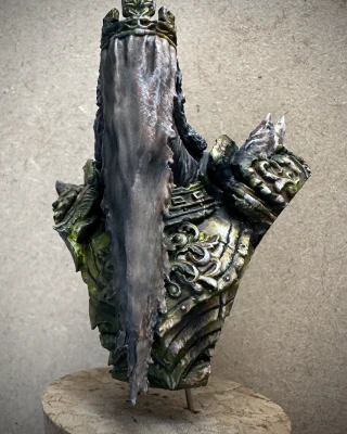 The same bust from before, but with yellows and browns starting to replace the monochrome.