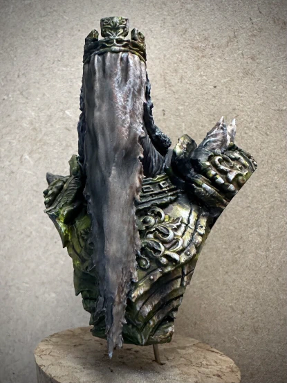 The same bust from before, but with yellows and browns starting to replace the monochrome.