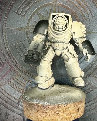 A freshly-primed 40K Terminator mini with some 3D-printed GreyTide Studios bits added for theme.