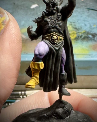 Skele-man _triumphantly_ raising a lack-of-hand aloft.