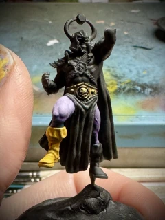 Skele-man _triumphantly_ raising a lack-of-hand aloft.
