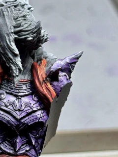 A pointy bit of the Spooky Lady may be casting a small pointy shadow, or her spooky cape may just need a wash.
