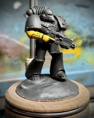 Just a lil guy with a lil yellow arm. The miniature is approximately half the size of one (1) human thumb but will take eleventy billion years to paint smoothly.