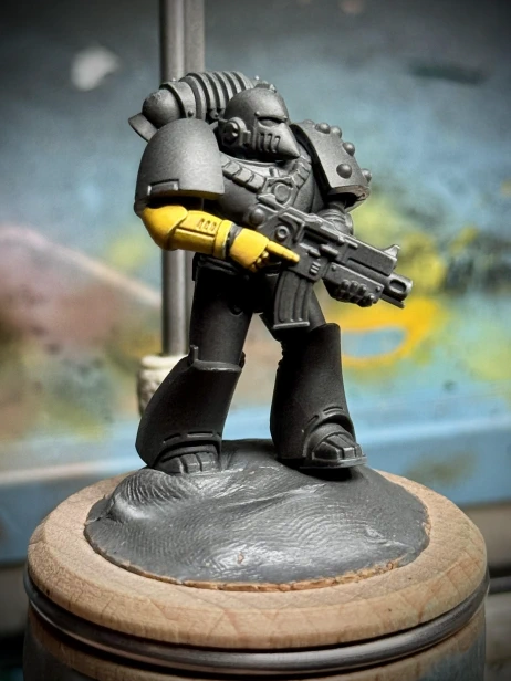 Just a lil guy with a lil yellow arm. The miniature is approximately half the size of one (1) human thumb but will take eleventy billion years to paint smoothly.