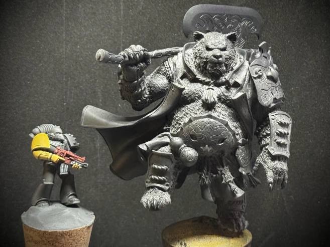 A 25mm lil guy (with standard reference yellow arm) next to a 70mm lil guy.