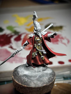 Front view of the lil guy with the remaining fabric elements now red instead of primer white.
