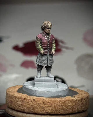 An unusual, some might say bold, choice has been made to focus painted light like a green laser on the lower part of his arms.