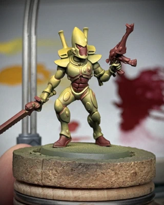 A very similar mini to the last, this time with Averland Sunset (Citadel) as the primary colour and Berserker Red (Two Thin Coats) as the accent. No details are specifically picked out, just letting the sculpt be the sculpt. Craven Yellow (TTC) used very sparingly as an extreme highlight.
