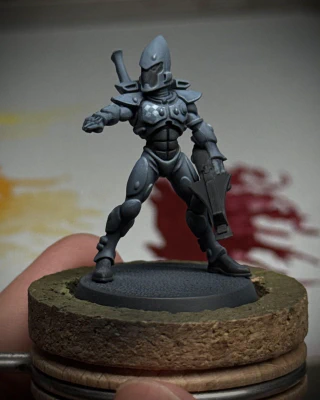The definitely-not-a-cop blue-grey space Eldar mini from before, still just referred in blue-grey and black, but with an extra point of interest added to their right pec: a brighter blue-grey diamond pattern that reads like white.