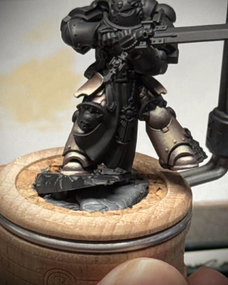 Continuing the stippling effect across both legs of the mini, trying to give a sense of age or tarnish rather than damage, trying to keep the contrast established on the first boot.