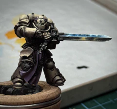 Some careful poking and sweaty blending and finally the mini is now almost indistinguishable from the previous shot. Except that he seems to have something in his right eye? He’s not crying, _you’re_ crying.
