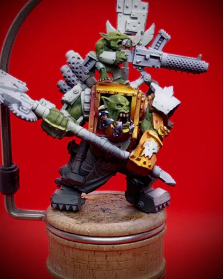 Our friendly Ork chum now has some ‘yellow’ (orange, wearing many hats) on his hoodie and a start at some NMM on his dentures. The denture adventure left a visible wound above one eyebrow. As can happen.