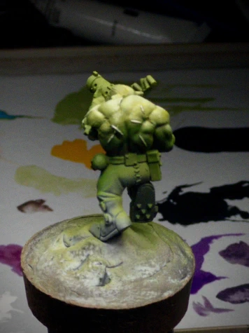 The same Ork mini with (maybe? cool story, bro) a little more warmth and actual colour in the highlights. The scarring on the figure’s back has also been picked out with the strongest highlight, even in the darkest shadow.