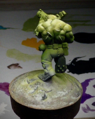 The same Ork mini with (maybe? cool story, bro) a little more warmth and actual colour in the highlights. The scarring on the figure’s back has also been picked out with the strongest highlight, even in the darkest shadow.