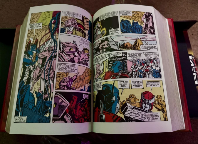 Compendium volume 1 opened to a random page with poor old Bumblebee apparently in the hands of Shockwave, who is clearly up to his old tricks again.