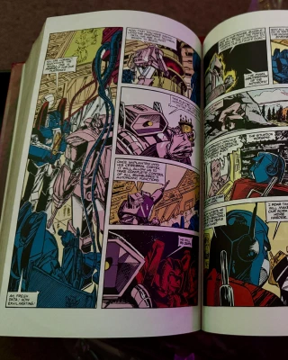 Compendium volume 1 opened to a random page with poor old Bumblebee apparently in the hands of Shockwave, who is clearly up to his old tricks again.