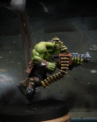 More detail, both dark and bright, and secondary reflections have been added to the shell casings and the gun barrel. Still, the only thing you really notice in the shot is GREEEN.

Perhaps, this is how it should be.