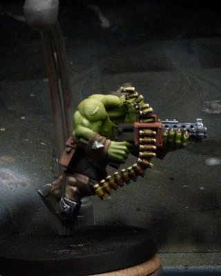 More detail, both dark and bright, and secondary reflections have been added to the shell casings and the gun barrel. Still, the only thing you really notice in the shot is GREEEN.

Perhaps, this is how it should be.