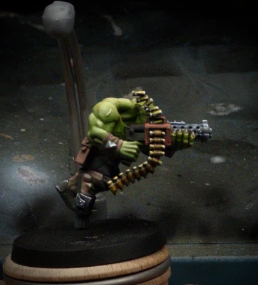 More detail, both dark and bright, and secondary reflections have been added to the shell casings and the gun barrel. Still, the only thing you really notice in the shot is GREEEN.

Perhaps, this is how it should be.