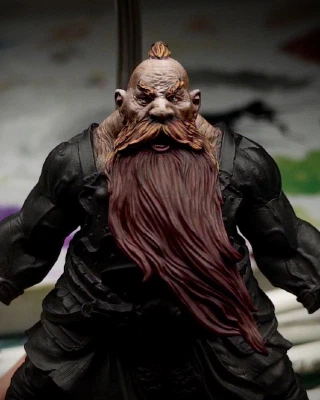 A dark red base coat has been applied to a beard larger than the average human torso. A start has been made in layering up towards orange on the many, overlapping moustache mini-beards.