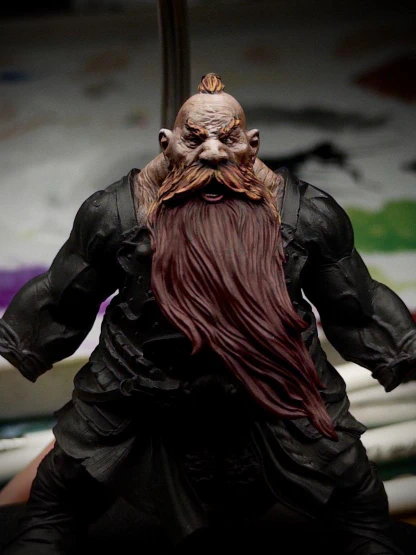 A dark red base coat has been applied to a beard larger than the average human torso. A start has been made in layering up towards orange on the many, overlapping moustache mini-beards.