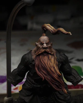 A topknot has been attached to the head of the mini, the same red-to-orange highlight pass has been applied.