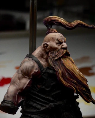 Angry-Face’s beefy right arm now has some paint on it. Thin layers of dark red and progressively lighter brown are being applied. The black primer still bleeds through the layers giving (hopefully? I think?) a sense of translucent skin-over-meat.