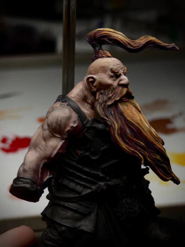 Angry-Face’s beefy right arm now has some paint on it. Thin layers of dark red and progressively lighter brown are being applied. The black primer still bleeds through the layers giving (hopefully? I think?) a sense of translucent skin-over-meat.