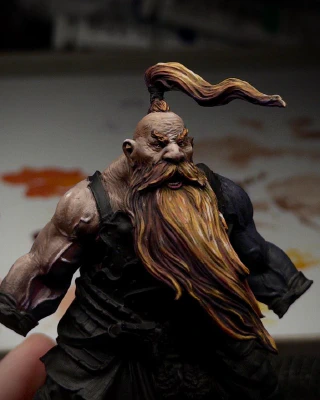 One (absurdly muscular) arm of the mini now has a range of tones from purple in deepest shadow through reddish browns to a small specular highlight of pure ivory on the side delt. Veins, as they say, are poppin’.