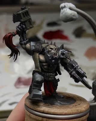 Sketchy blocking-in of leather jerkin, Obligatory Checkerboard & Triangles™️ on the pauldrons, and roughed-up bionic bits.