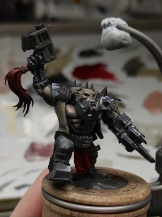 Sketchy blocking-in of leather jerkin, Obligatory Checkerboard & Triangles™️ on the pauldrons, and roughed-up bionic bits.