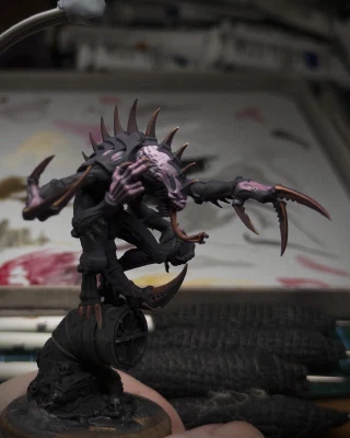 Some parts may be _slightly_ pinker, some slightly not as purple any more. Is dark red a possibility? Who amongst us can even say for sure?

A surprising number of paint tubes (not even used here) and grip-tape-wrapped brushes are also visible. More than a normal number.
