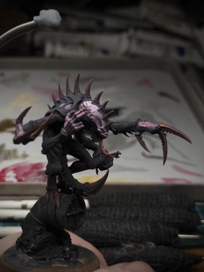 Some parts may be _slightly_ pinker, some slightly not as purple any more. Is dark red a possibility? Who amongst us can even say for sure?

A surprising number of paint tubes (not even used here) and grip-tape-wrapped brushes are also visible. More than a normal number.