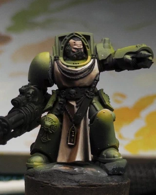 Some paler greens and yellows are applied to the mini for a bit of tonal variation and highlighting on various upward facing pointy bits. Really hard to tell if it’s having the desired effect when you insist on painting green while knowing you have red/green colour blindness. Why do you do that, you numpty? Blue is right there. ‘Spider-Man Noir With The Rubik’s Cube’ needs to be added to my personal Darmok language.