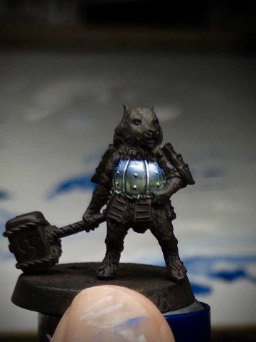 The tiny pupper’s breastplate now has a mix of blues and greens blobbed together in something that might, if you squint, be taken for a reflection of unseen surrounding nature. Heavy white has been applied on the uppermost curvy bits in a lie (blatant! unrepentant!) to imply bright directional light.