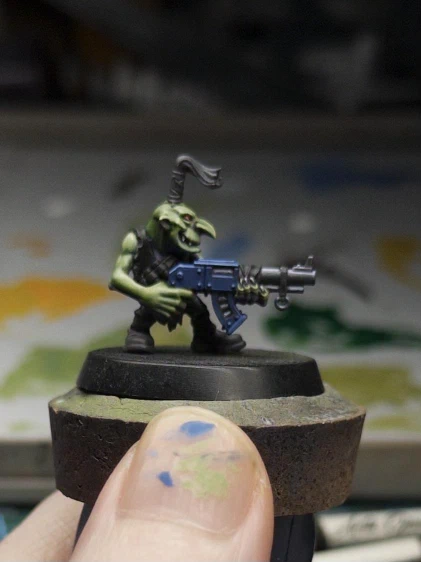 The friendly little guy has a blue-and-gunmetal blue gun! Where’d he get that from? I blame the parents.