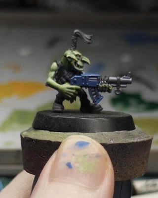 The friendly little guy has a blue-and-gunmetal blue gun! Where’d he get that from? I blame the parents.